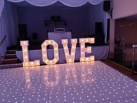 Love signs and dance floor for hire.